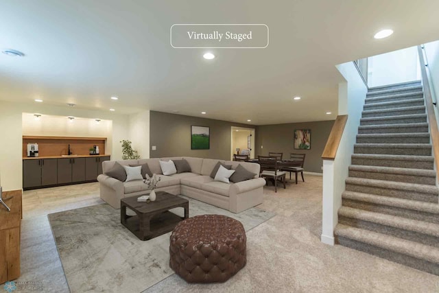 living area with stairway and recessed lighting