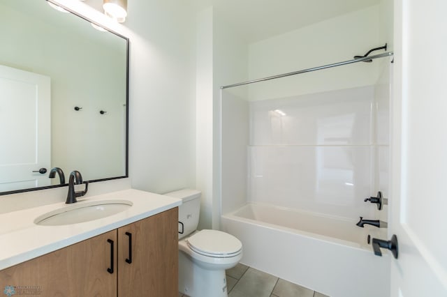 bathroom with toilet, vanity, tile patterned floors, and bathtub / shower combination