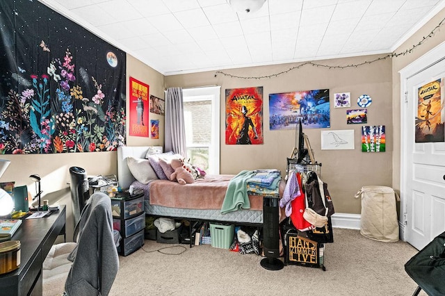 carpeted bedroom with ornamental molding