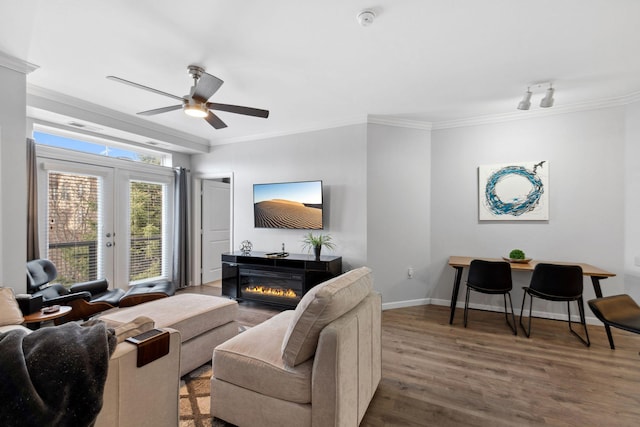 13580 Technology Dr Unit 3202, Eden Prairie, MN 55344 - living area with ornamental molding, french doors, wood finished floors, ceiling fan, and a glass covered fireplace