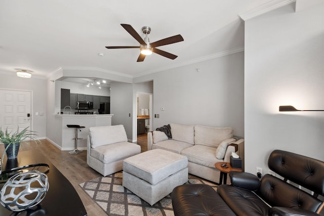13580 Technology Dr Unit 3202, Eden Prairie, MN 55344 - living area featuring a ceiling fan, crown molding, light wood-style floors, and baseboards