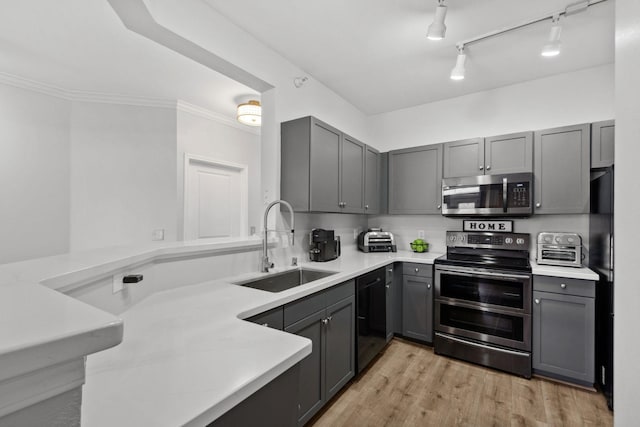 13580 Technology Dr Unit 3202, Eden Prairie, MN 55344 - kitchen with appliances with stainless steel finishes, a sink, gray cabinetry, light countertops, and crown molding