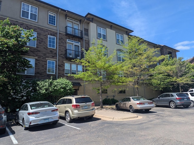 13580 Technology Dr Unit 3202, Eden Prairie, MN 55344 - view of building exterior with uncovered parking
