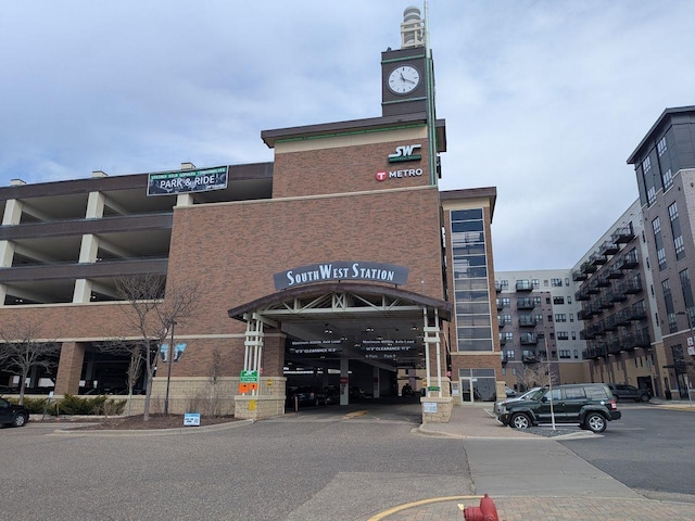 13580 Technology Dr Unit 3202, Eden Prairie, MN 55344 - view of building exterior with uncovered parking