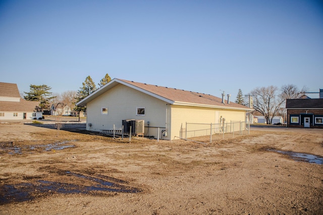 back of property featuring fence