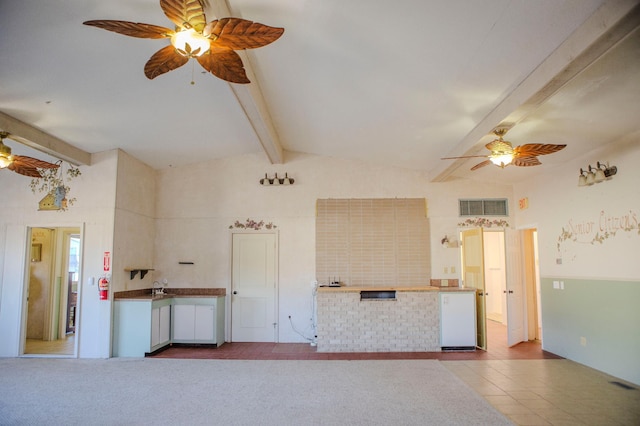 interior space featuring fridge, visible vents, lofted ceiling with beams, and ceiling fan