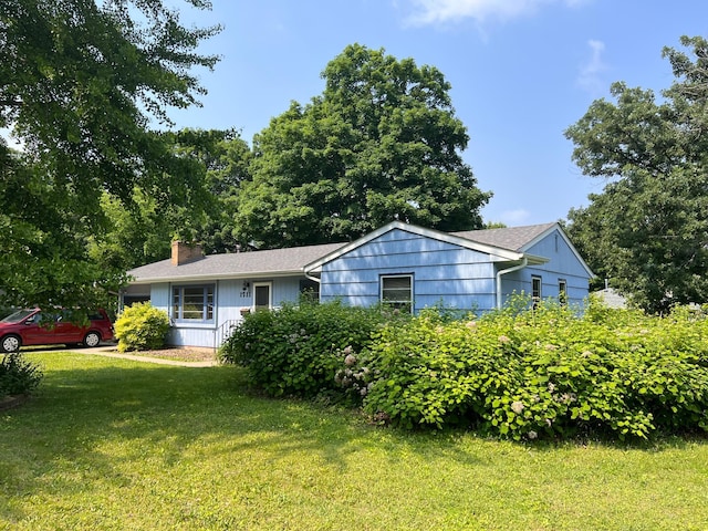 1711 Winnetka Ave N, Golden Valley, MN 55427 - single story home with a front lawn and a chimney