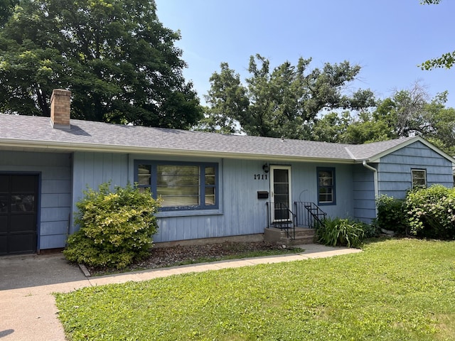 1711 Winnetka Ave N, Golden Valley, MN 55427 - ranch-style home with a chimney, a front yard, a shingled roof, and driveway