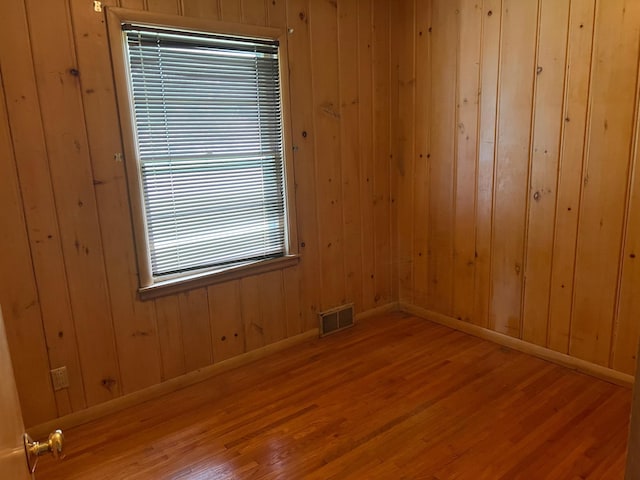 1711 Winnetka Ave N, Golden Valley, MN 55427 - unfurnished room featuring wood finished floors and wood walls