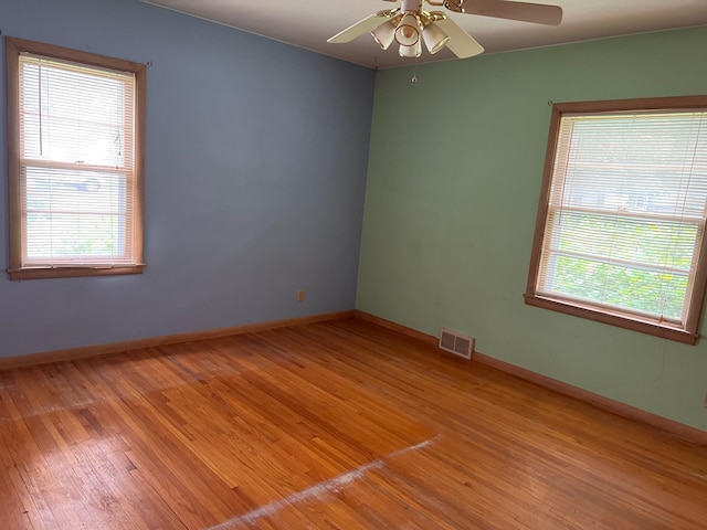 1711 Winnetka Ave N, Golden Valley, MN 55427 - unfurnished room with light wood-style flooring and ceiling fan
