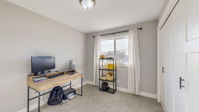 carpeted home office with baseboards