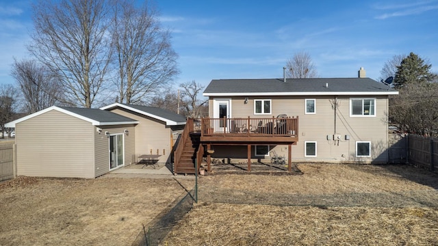 rear view of house featuring a fenced backyard, a patio area, and a deck