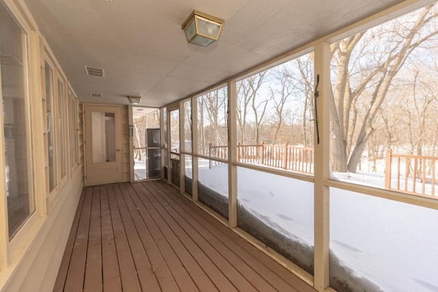 unfurnished sunroom with visible vents and a wealth of natural light