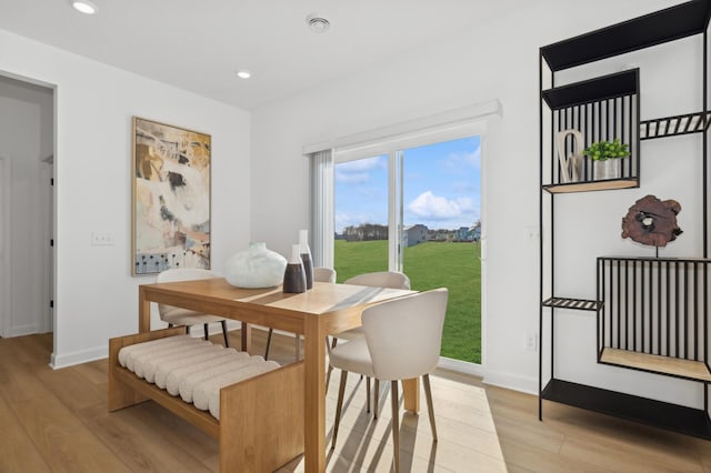 dining area with recessed lighting, baseboards, and light wood-style floors