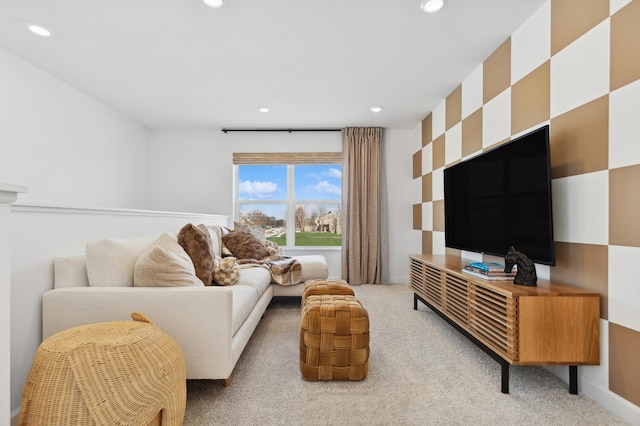 living area featuring recessed lighting, baseboards, and light carpet