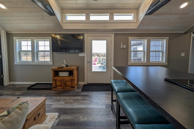 foyer featuring dark wood finished floors, wooden ceiling, baseboards, and lofted ceiling