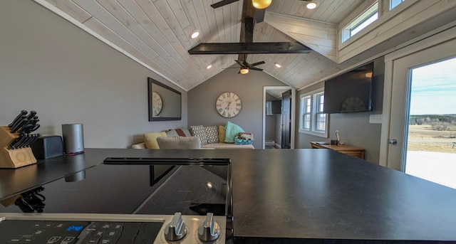 kitchen featuring lofted ceiling with beams, wood ceiling, and a ceiling fan