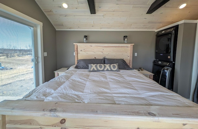 bedroom with vaulted ceiling, wood ceiling, a ceiling fan, and stacked washer and dryer