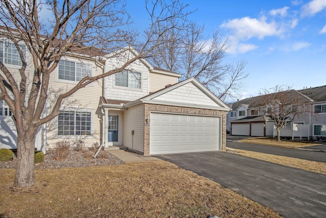 view of front of home with driveway and an attached garage