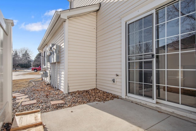 property entrance featuring a patio area