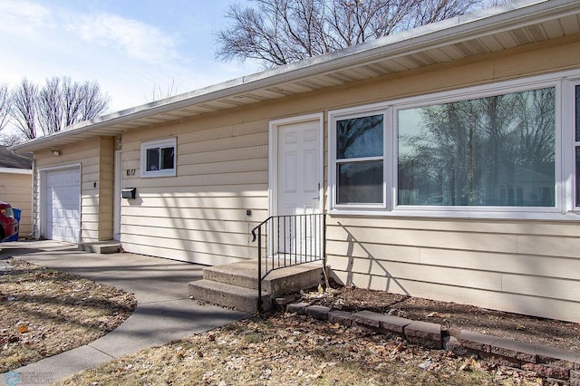 property entrance with a garage