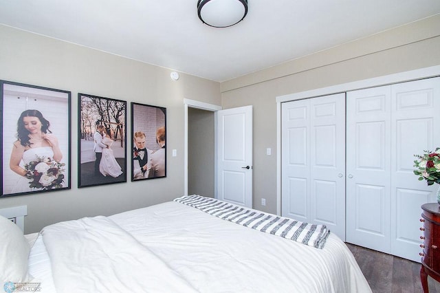 bedroom featuring a closet and dark wood-type flooring