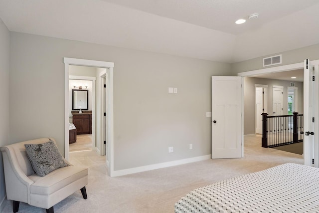 bedroom with light carpet, visible vents, baseboards, and vaulted ceiling