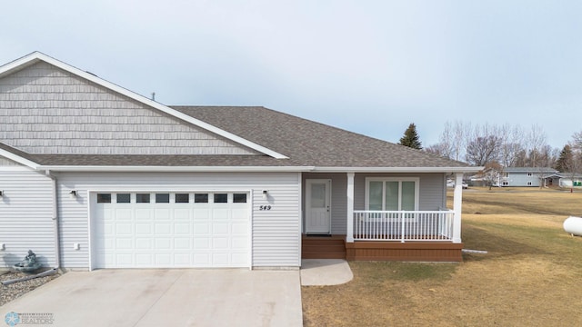 view of front of home with a porch, roof with shingles, concrete driveway, an attached garage, and a front yard