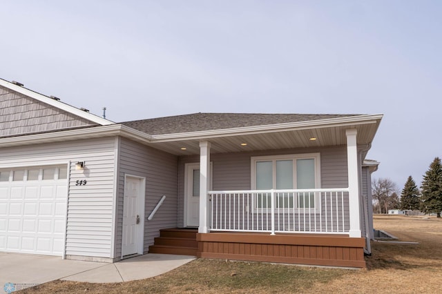 ranch-style home featuring roof with shingles, a porch, and an attached garage