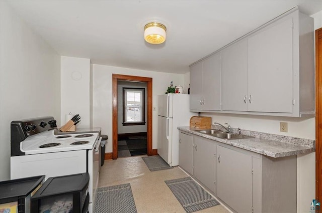 3729 2nd St, Superior, WI 54880 - kitchen with white appliances, a sink, light countertops, and baseboards