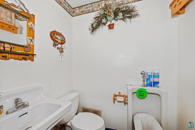 3729 2nd St, Superior, WI 54880 - bathroom with toilet and a sink