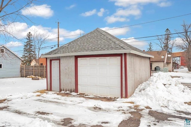 3729 2nd St, Superior, WI 54880 - snow covered garage featuring a garage and fence
