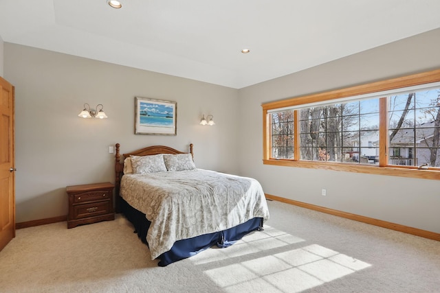 bedroom with recessed lighting, light colored carpet, and baseboards