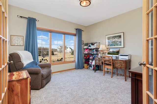 carpeted home office with visible vents and baseboards