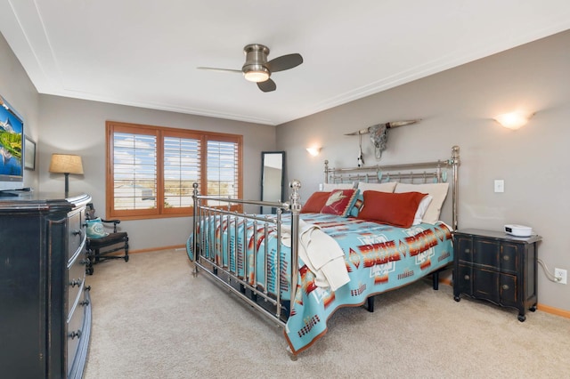 bedroom featuring a ceiling fan, baseboards, and carpet floors