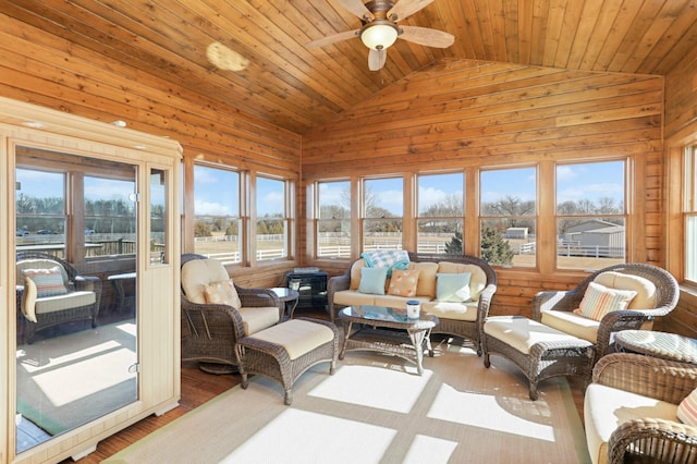 sunroom / solarium with wood ceiling, ceiling fan, and vaulted ceiling