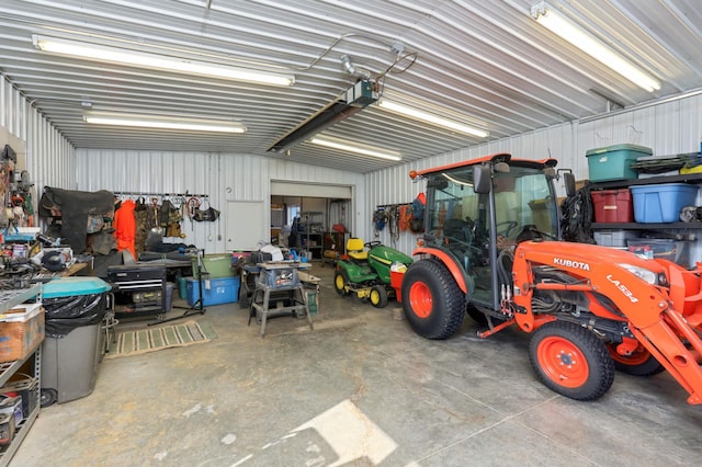 garage featuring metal wall and a garage door opener