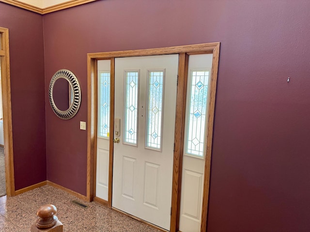 foyer with visible vents, a healthy amount of sunlight, and baseboards