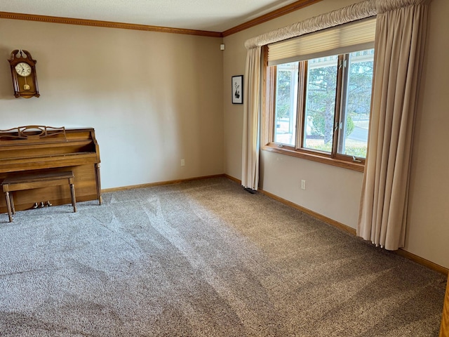 interior space featuring baseboards and crown molding