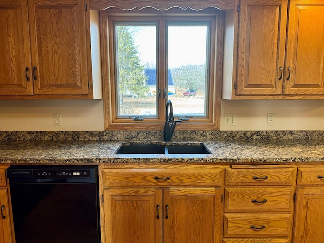 kitchen with black dishwasher, brown cabinets, and a sink