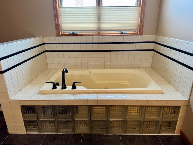 full bathroom with tile patterned flooring and a jetted tub