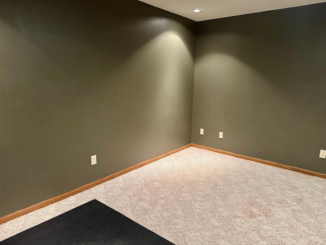 carpeted empty room with recessed lighting and baseboards