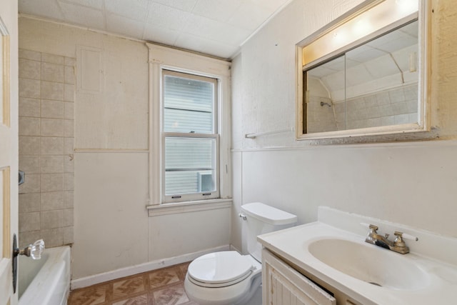 full bath with vanity, toilet, washtub / shower combination, and baseboards