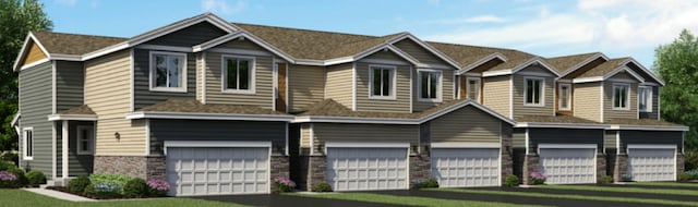 view of front facade with stone siding and driveway