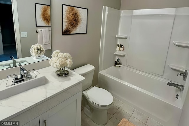 bathroom featuring vanity, tile patterned floors, toilet, and tub / shower combination