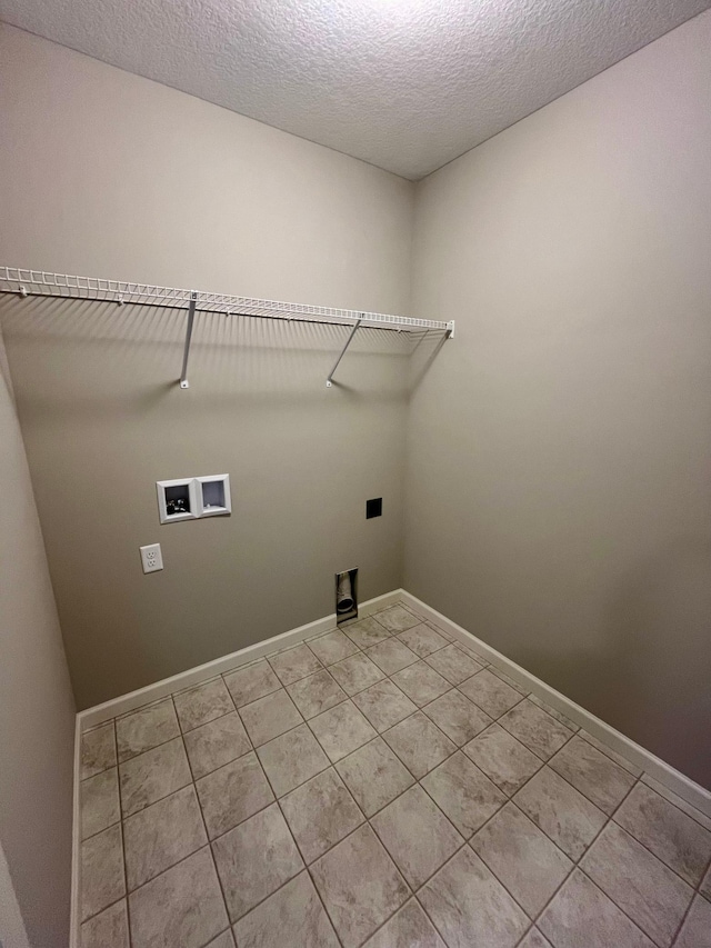 clothes washing area with washer hookup, a textured ceiling, baseboards, hookup for an electric dryer, and laundry area