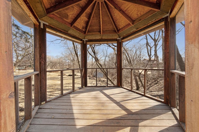 wooden terrace featuring a gazebo