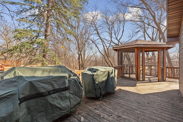 deck with a gazebo and a grill