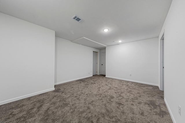 unfurnished room featuring recessed lighting, visible vents, baseboards, and carpet