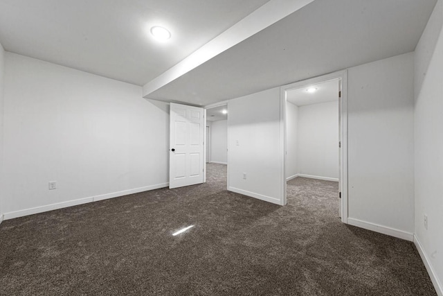 finished basement featuring baseboards and carpet floors